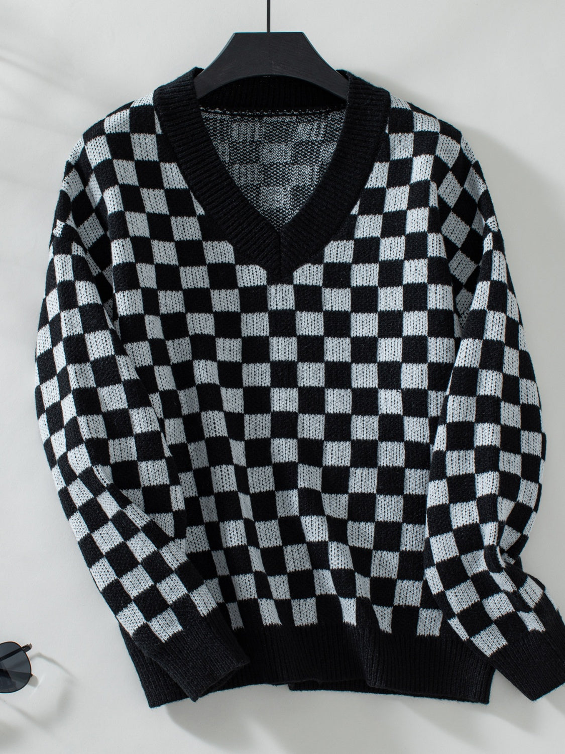 Cozy black knit with a bold checkerboard pattern for everyday wear.
