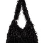 Black faux feather hobo bag with bold slouchy silhouette and snap closure.

