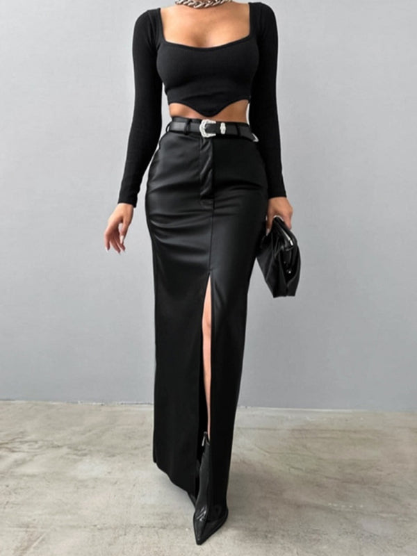 Women's black faux leather maxi skirt with front slit and fitted silhouette.
