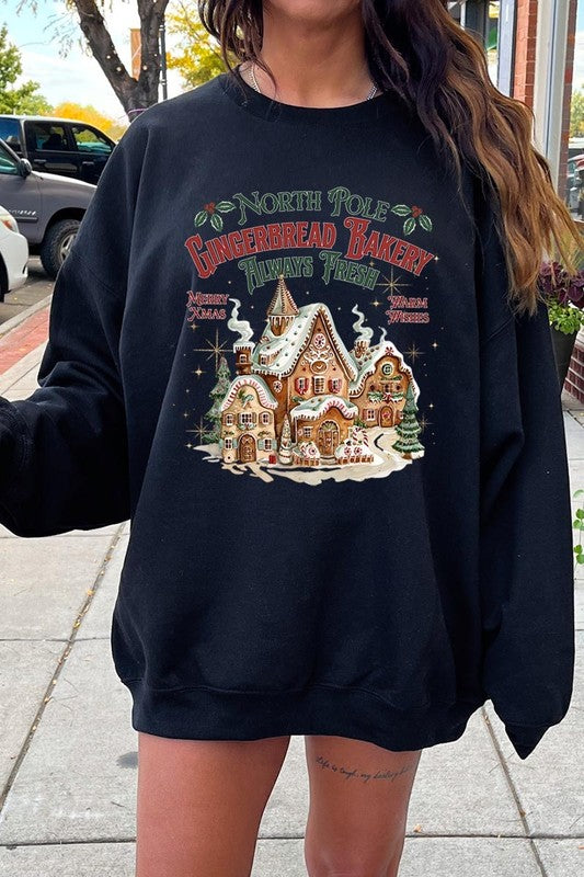 Classic black holiday sweatshirt with a festive gingerbread bakery graphic.