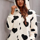 Black heart-print hooded jumpsuit in soft sherpa fabric
