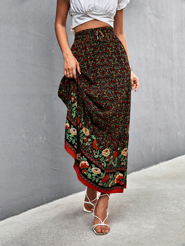 Front view of a black high-waist floral long skirt with a vibrant floral print.
