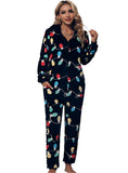 Black zip-front jumpsuit with colorful holiday light print and hood
