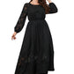 Front view of an elegant black lace long sleeve dress with an over-the-knee length.
