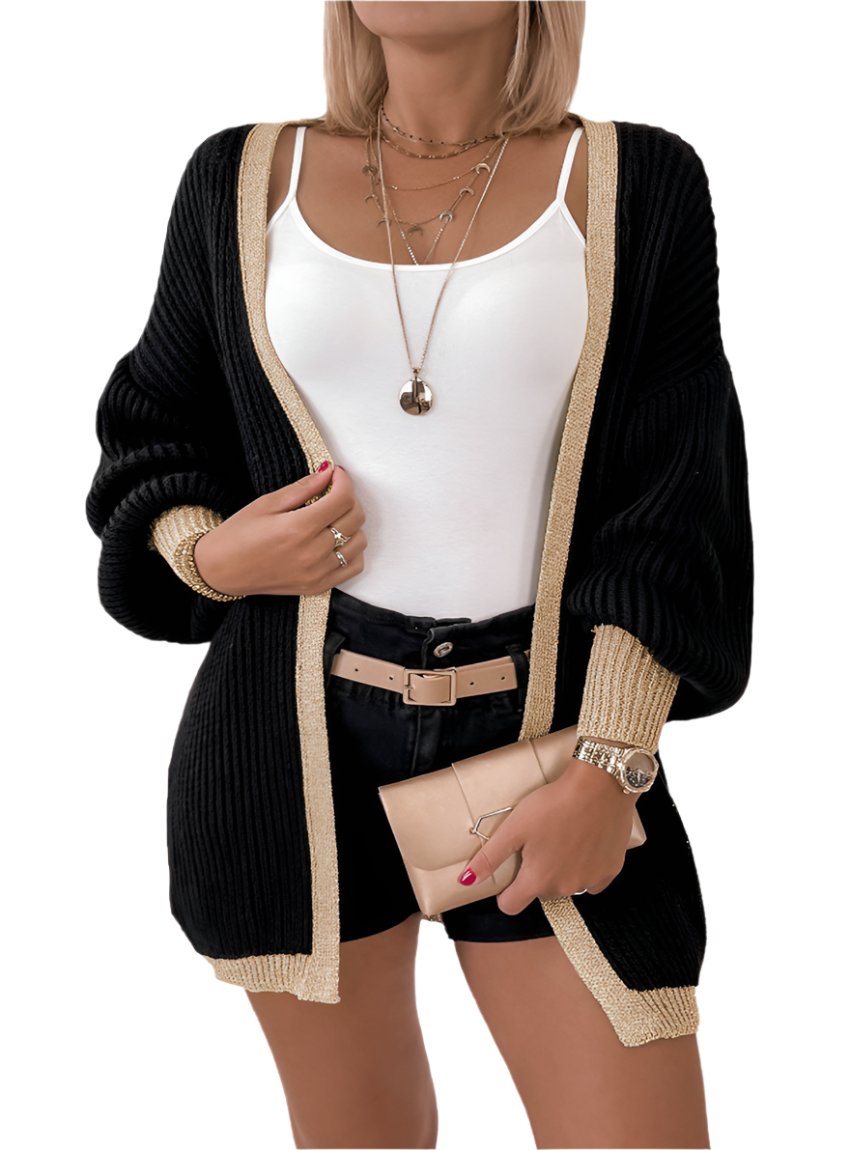 Front view of black cardigan with gold trim and lantern sleeves
