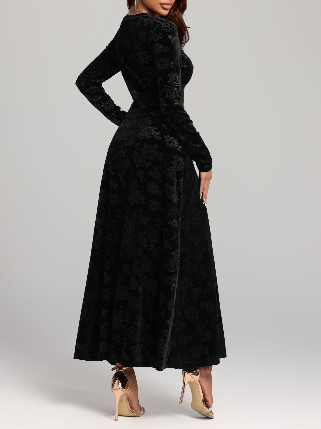 Black long sleeve midi dress featuring an embossed rose print and V-neck design.