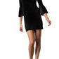 Full-length image of a black velvet mini dress with flared bell sleeves, front view.
