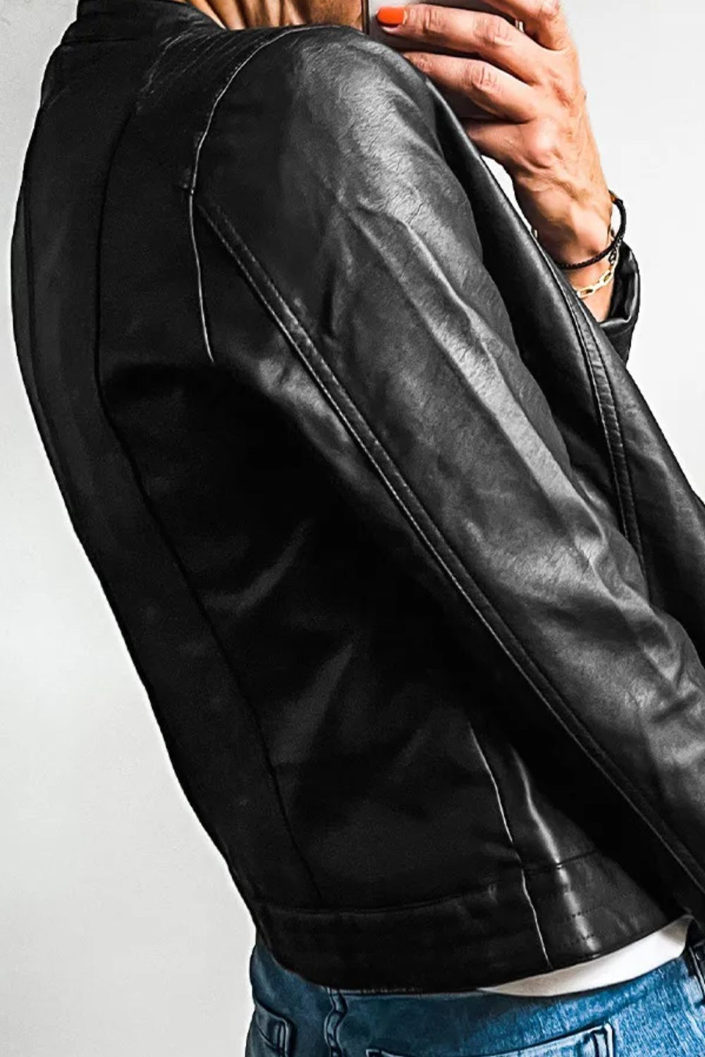 Women's pleather black jacket with an edgy, modern look.
