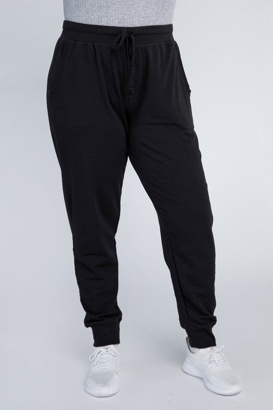 Black plus-size jogger pants shown in a front view.
