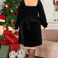 back view of black plus size smocked dress with square neckline
