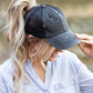 Black distressed messy bun hat cap with ponytail opening
