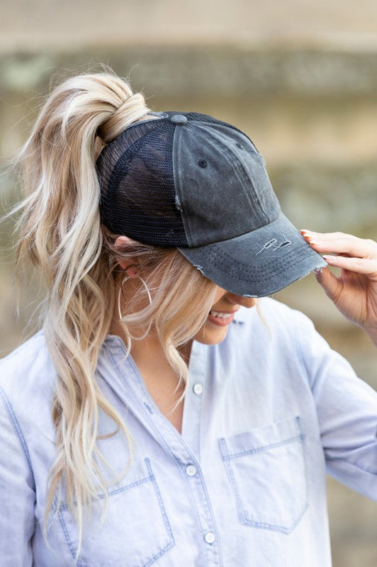 Black distressed messy bun hat cap with ponytail opening
