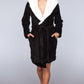 Full-length black robe with a cozy hood and faux fur lining, perfect for cold mornings.
