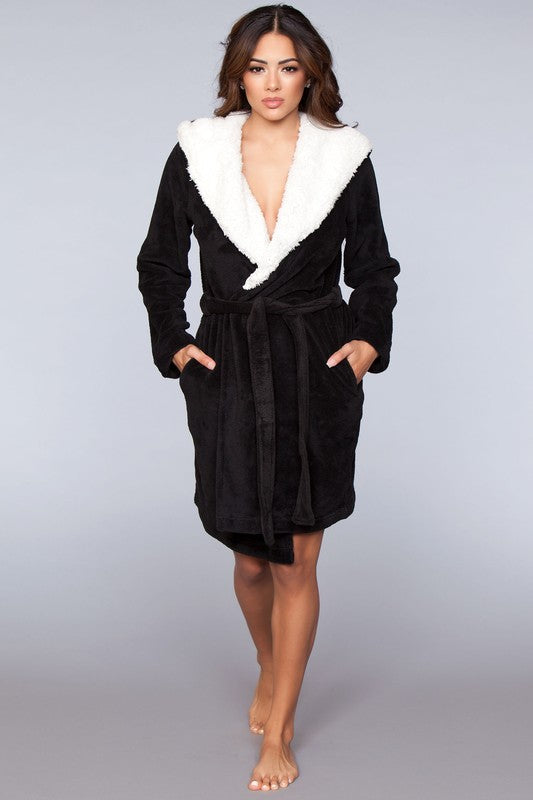 Full-length black robe with a cozy hood and faux fur lining, perfect for cold mornings.
