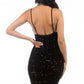 Back view of a sleeveless black sequin dress with a fitted silhouette.
