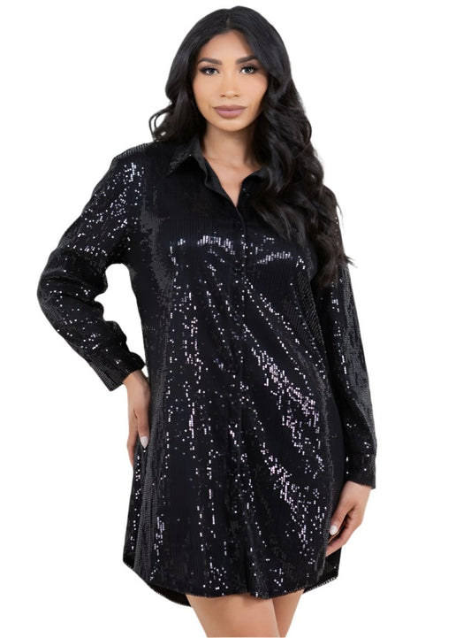 Model wearing a black sequin shirt dress with long sleeves and button-up front, front view.
