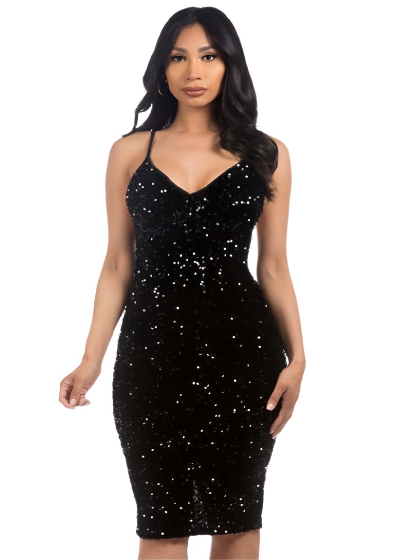 Model wearing a black sequin dress with spaghetti straps, front view.
