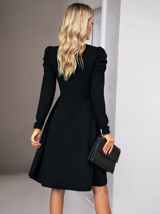 Elegant black solid color dress with ruched sleeves and a timeless design
