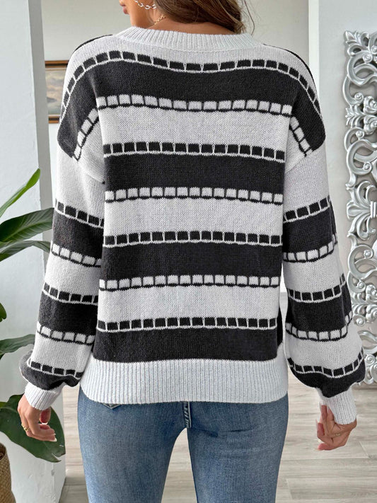 Black and white striped knit sweater with ribbed detailing