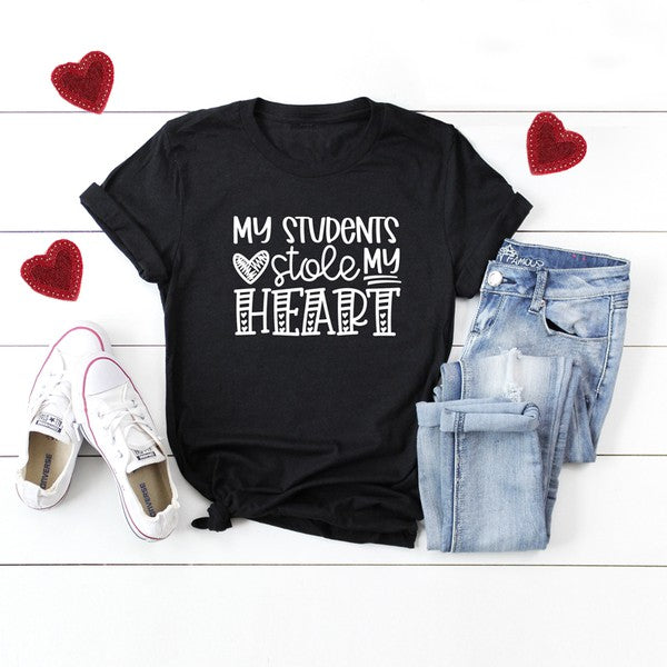 Close-up of black "My Students Stole My Heart" graphic tee