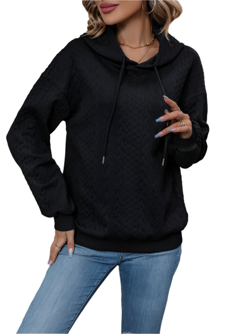 Women's black textured hoodie with cable knit design and drawstring hood.
