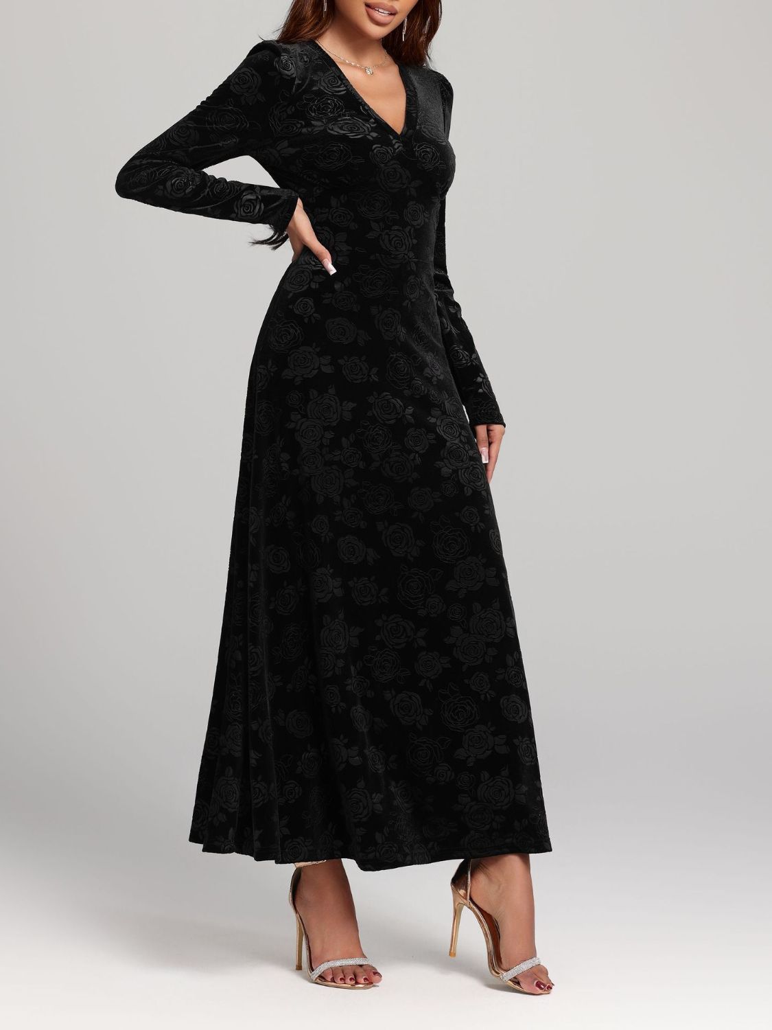 Black V-neck midi dress with long sleeves and embossed rose detailing.