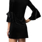 Back view of a black velvet mini dress, highlighting the simple yet elegant design.
