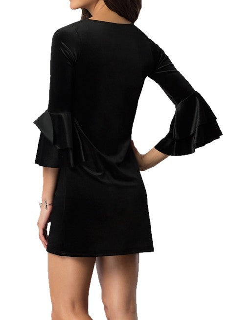 Back view of a black velvet mini dress, highlighting the simple yet elegant design.
