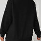 Black waffle-knit sweatshirt with a relaxed fit and side buttons for women.
