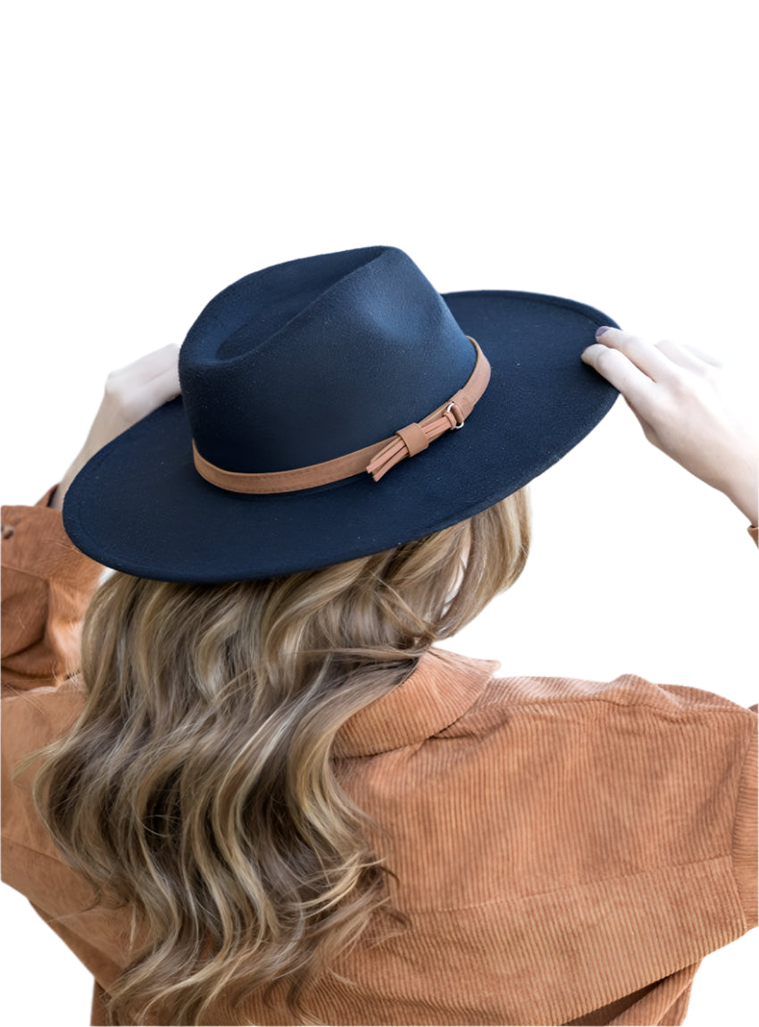 Black wide brim Panama hat with a tassel belt shown from the side profile.
