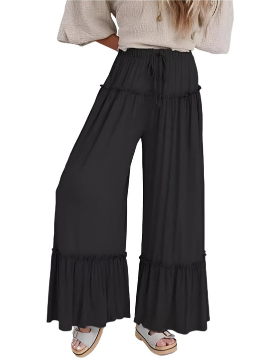 Front view of black wide-leg pants with frill hem and drawstring waist
