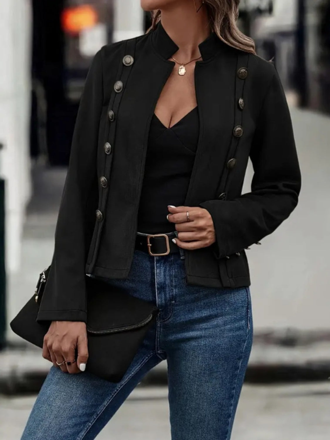 Women's black mock neck jacket for fall, offering a stylish and polished layering option.