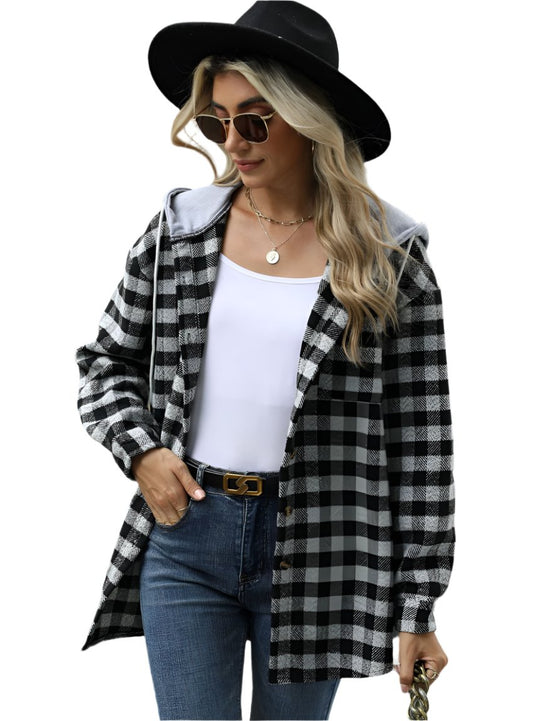 Woman wearing a black women's plaid jacket with hood and sunglasses
