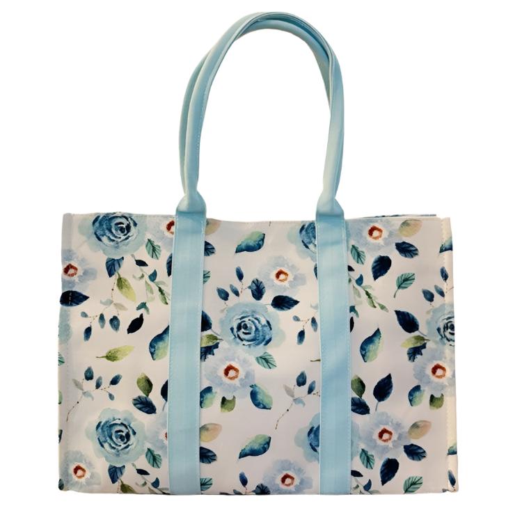 Front view of the Bloom Blue Floral Couture Tote with watercolor floral print.
