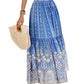 Close-up of blue boho skirt with intricate print and tied waistband detail.