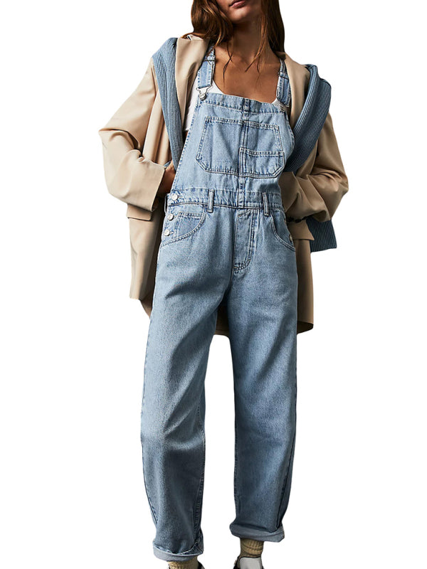 Front view of solid blue cotton overalls with adjustable straps.
