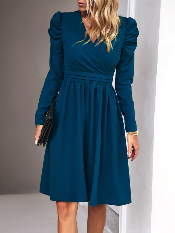 Classy blue V-neck dress for women featuring long sleeves and knee length
