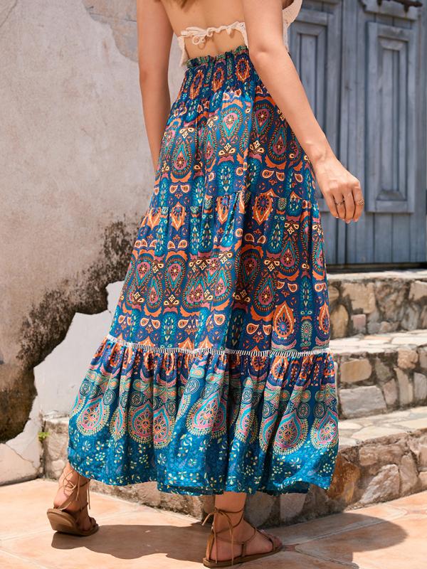 Side profile of a lightweight blue patchwork maxi skirt in an A-line silhouette.
