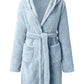 Cozy blue hooded fleece robe made from soft polyester fabric.
