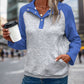 Blue quilted pullover featuring a textured geometric design and sporty style