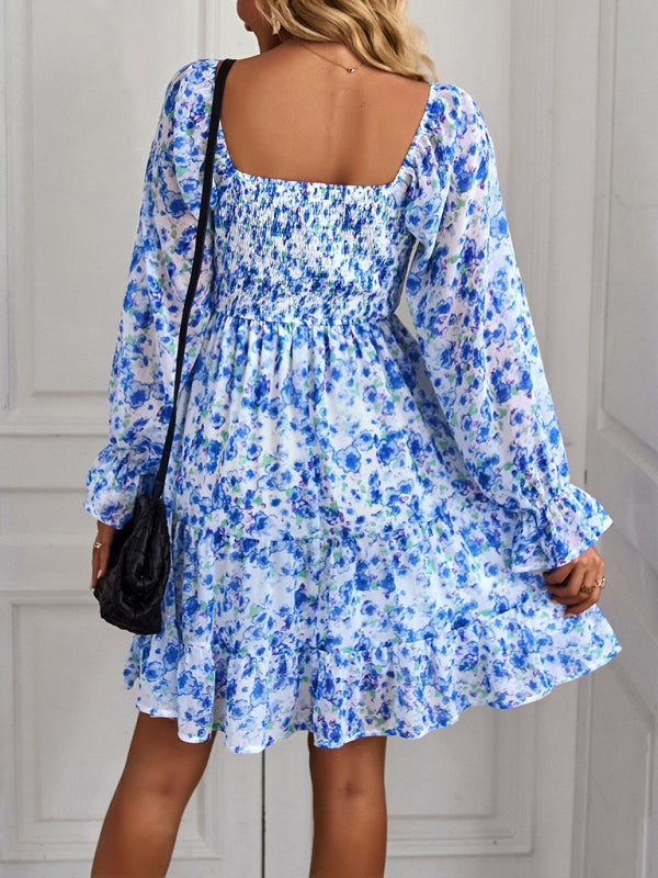 Blue floral-print dress with a bohemian vibe, complete with long sleeves and ruffle details.
