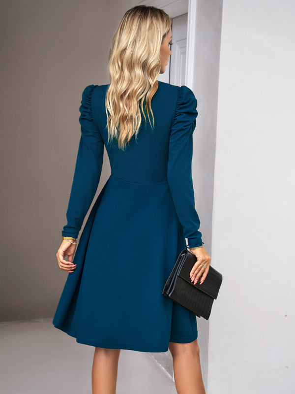 Elegant blue solid color dress with a timeless design and flowing fit
