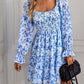 Bold blue dress featuring a bohemian floral design and flattering square neck.
