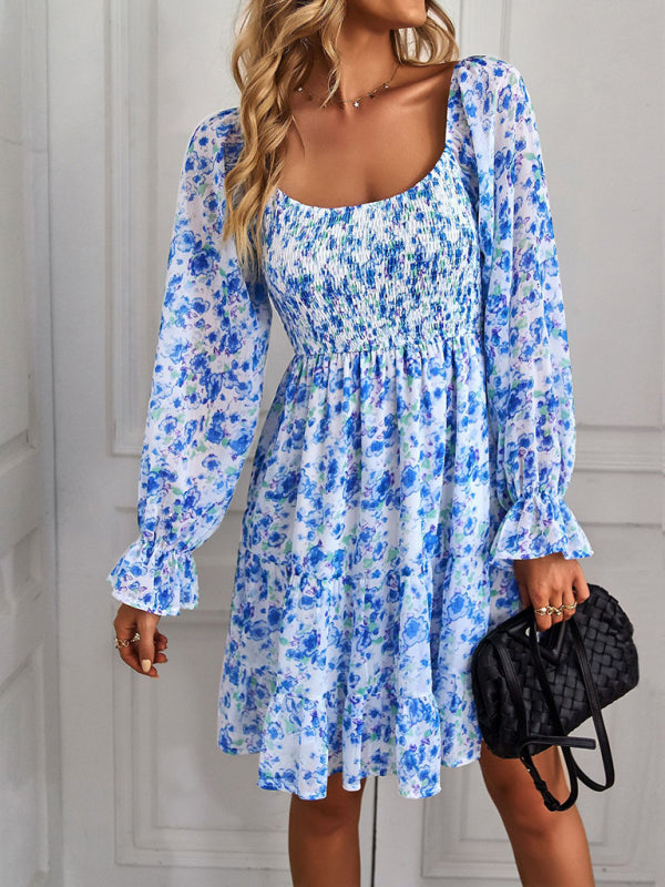 Bold blue dress featuring a bohemian floral design and flattering square neck.
