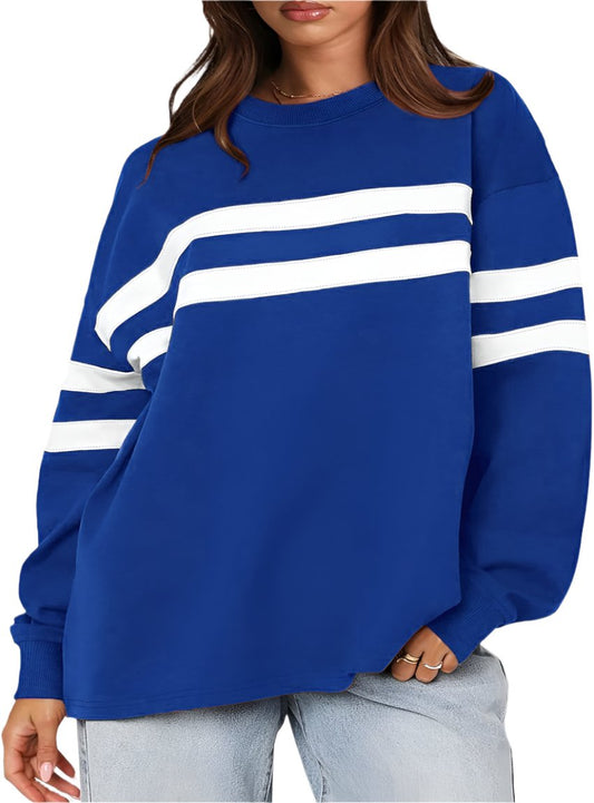 Blue oversized sweatshirt with bold white stripes, front view.
