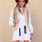 Vintage-inspired Western vest with embroidered detailing and shearling trim.
