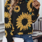 Bohemian-inspired black sweater with textured sunflower designs.
