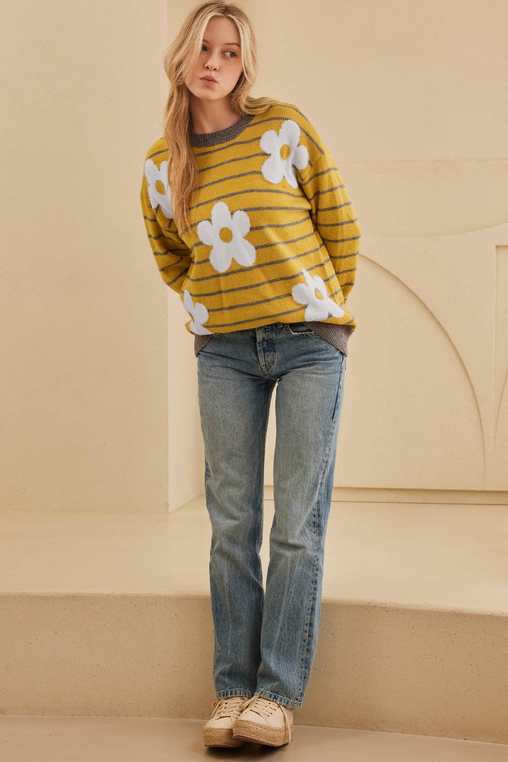 Woman in a yellow sweater with floral and striped details, ideal for cool weather | boho aesthetic
