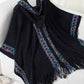 Boho black poncho with hood and fringe detailing
