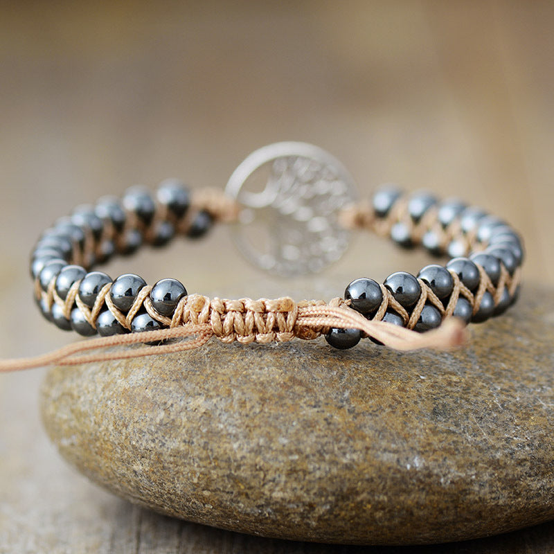 Boho chic silver bracelet featuring braided design
